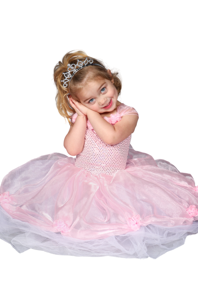 Smiling little dancer in a pink tutu and tiara