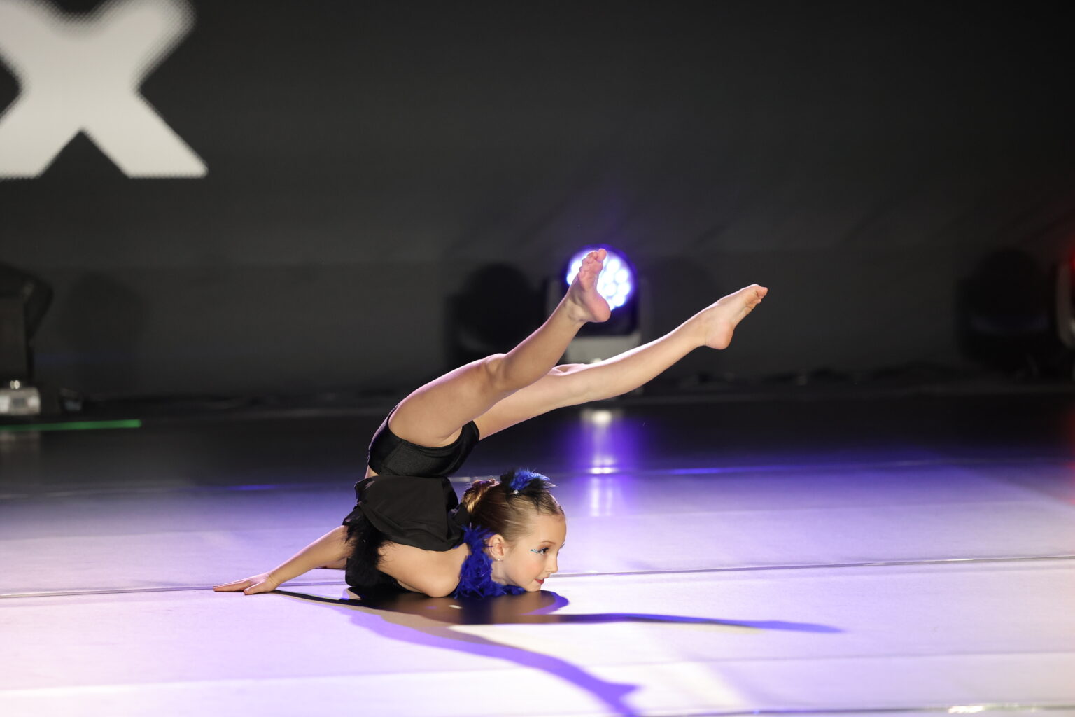 Young dancer performing on a competition stage